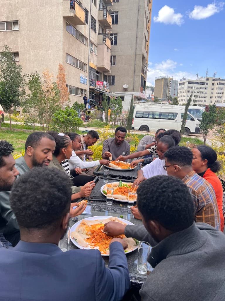 Community members sharing a meal together outdoors